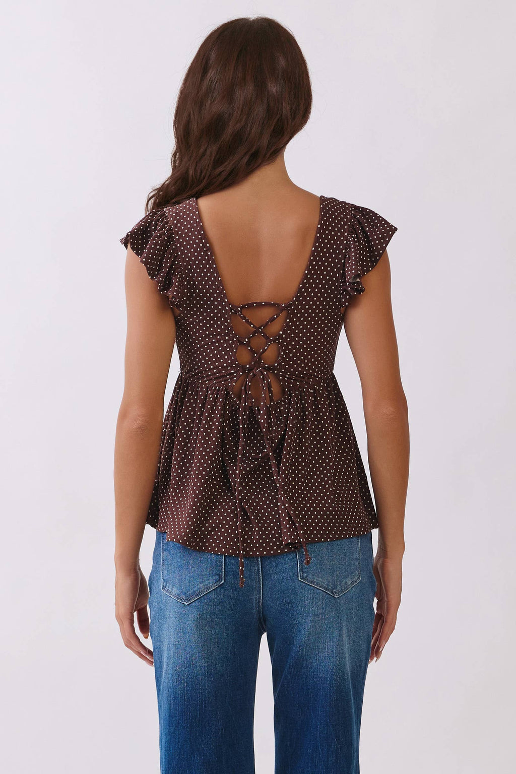 PRINTED PEPLUM TOP WITH TIE BACK DETAIL