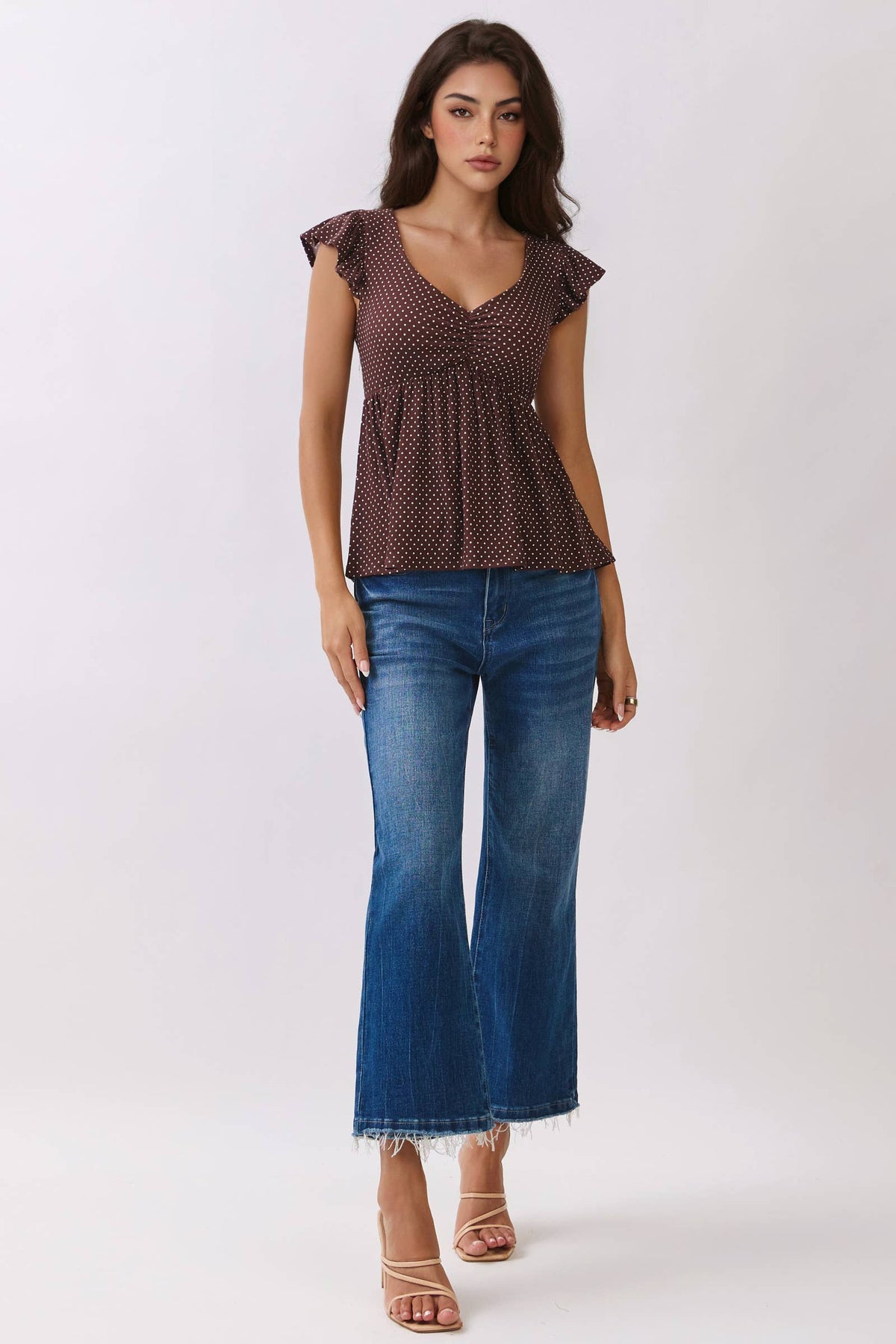 PRINTED PEPLUM TOP WITH TIE BACK DETAIL