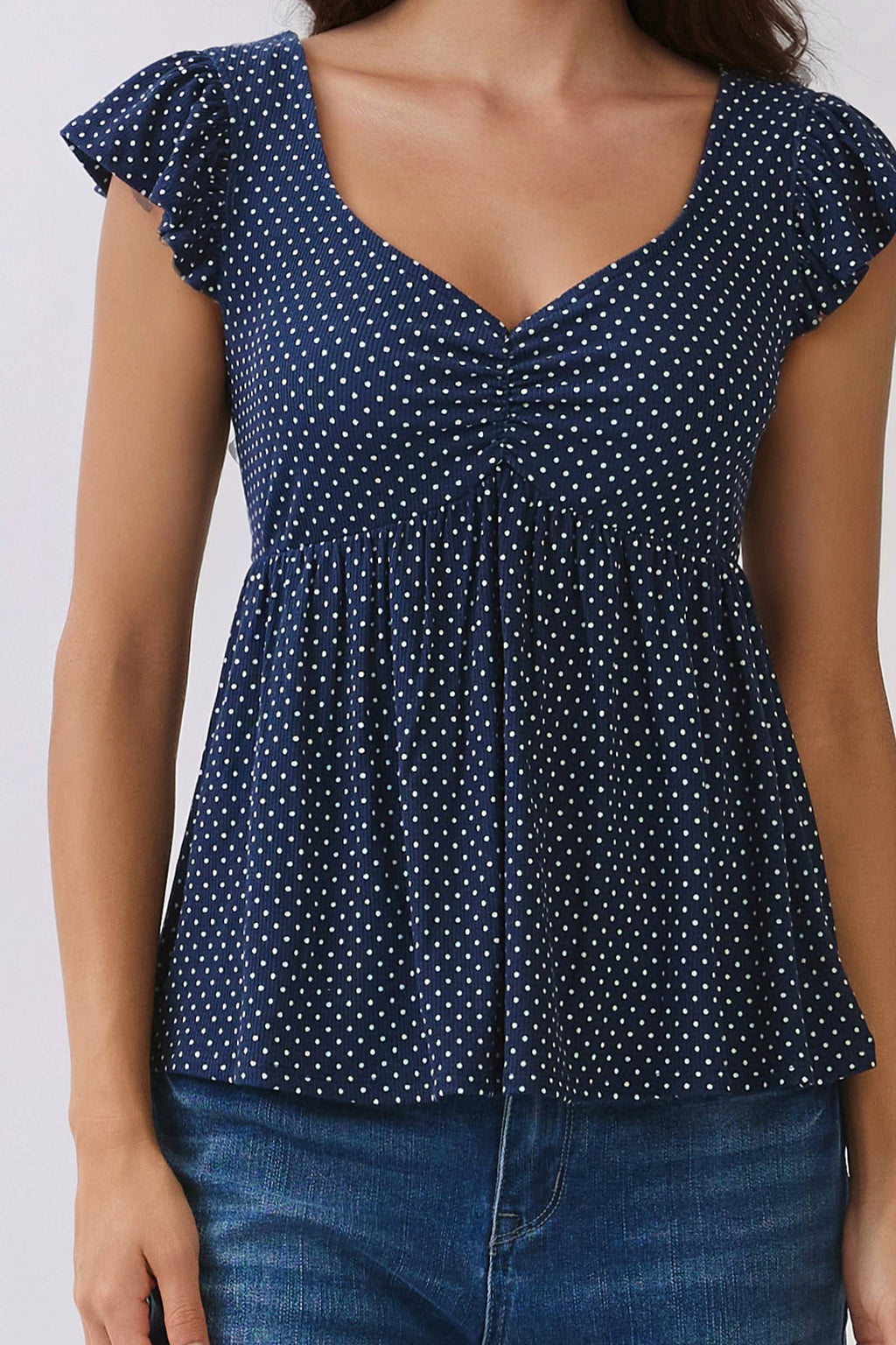 PRINTED PEPLUM TOP WITH TIE BACK DETAIL