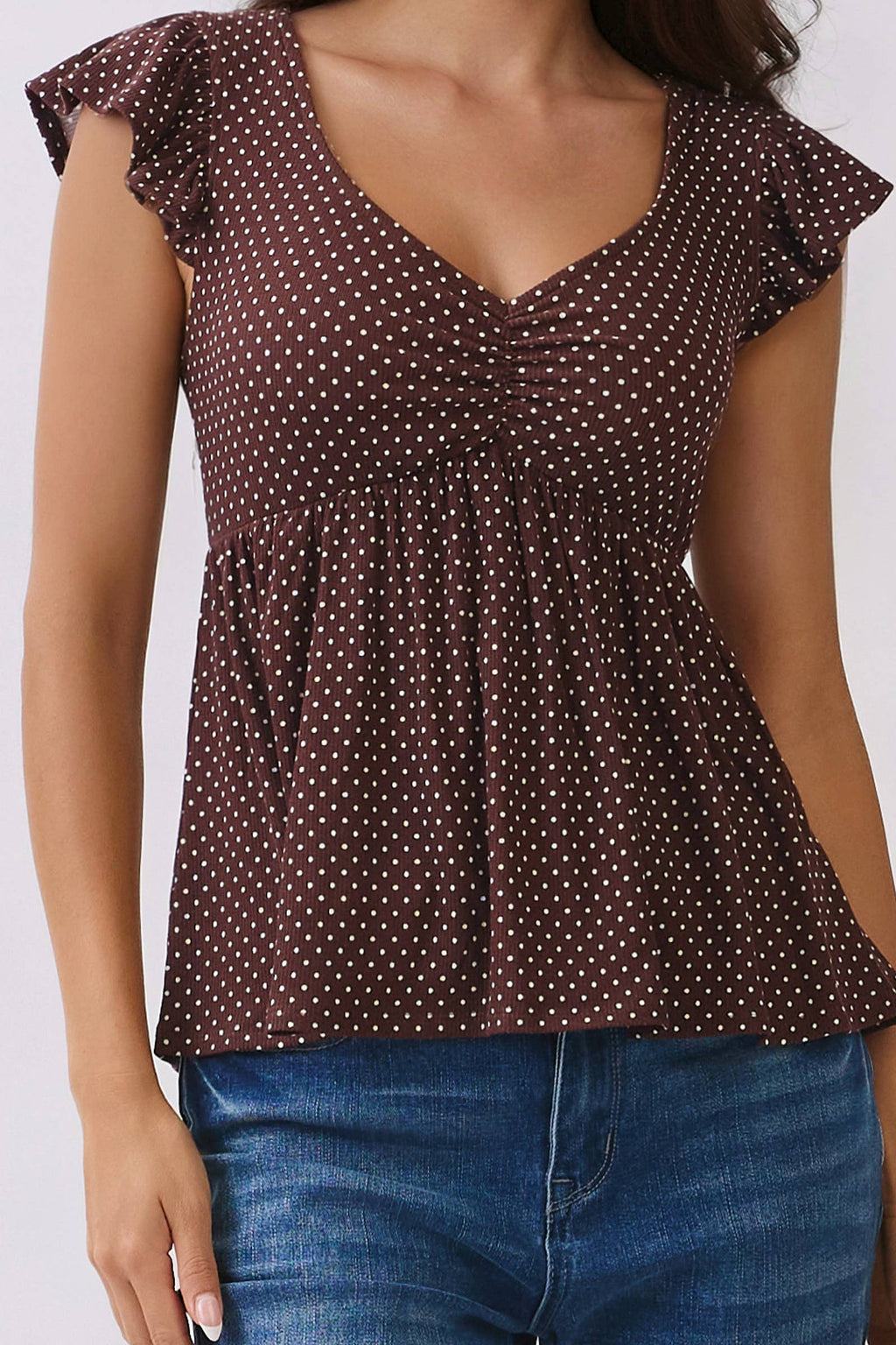 PRINTED PEPLUM TOP WITH TIE BACK DETAIL